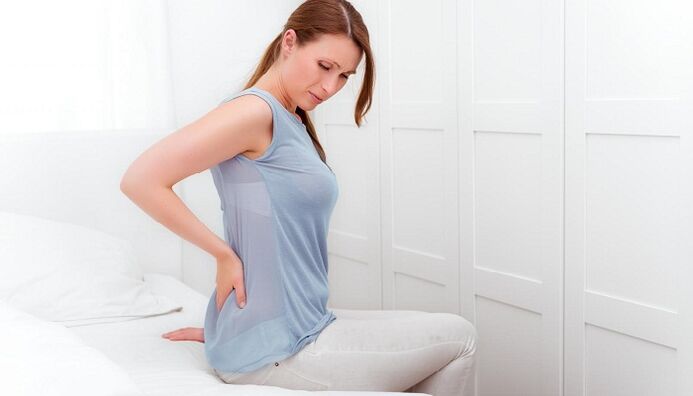A woman is worried about back pain